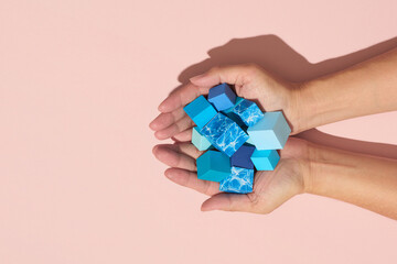 The hand holds a cube with photo wave