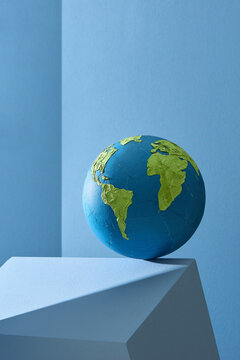 Earth globe on table with light