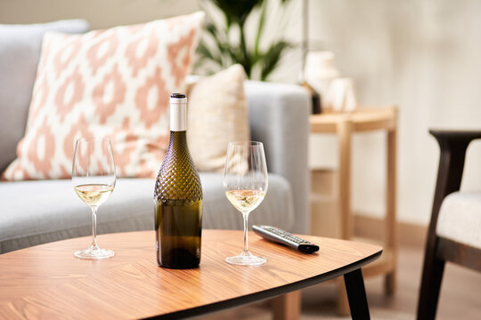 Bottle and two wineglasses.