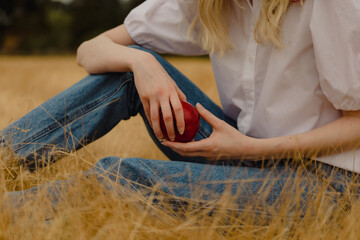 Young woman holding apple