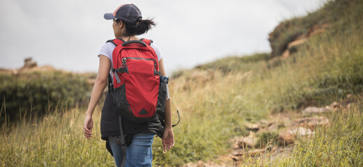 Women hiker with backpack adventure on the mountain, outdoor for education nature on vacation. Travel and Lifestyle Concept