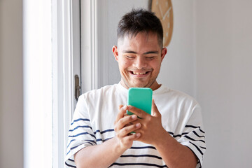 Down syndrome man using smartphone