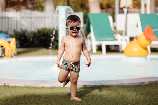 Stylish boy near pool