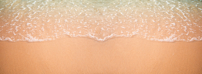 Fototapeta premium Coast sand beach white wave and bue sea close up. ocean tropical nature summer. for tourist relax vacation travel in holidays.