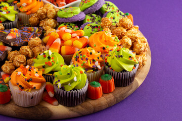 Halloween Themed Charcuterie Board on a Dark Purple Background