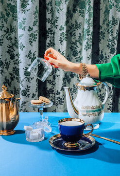 Stylish female hands  at tea time/party