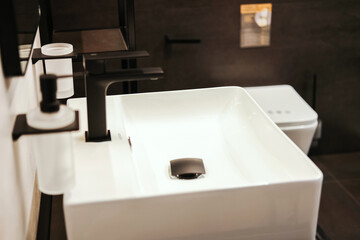 Modern bathroom interior design. Stylish sink in the design of a new home