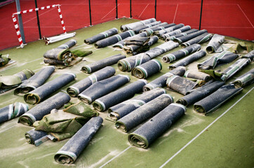 Artificial grass rolls aligned on a soccer field