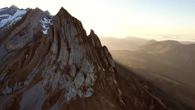 Aerial flyover over Schaefler in Appenzell, Switzerland next to the Altenalp Turm peak