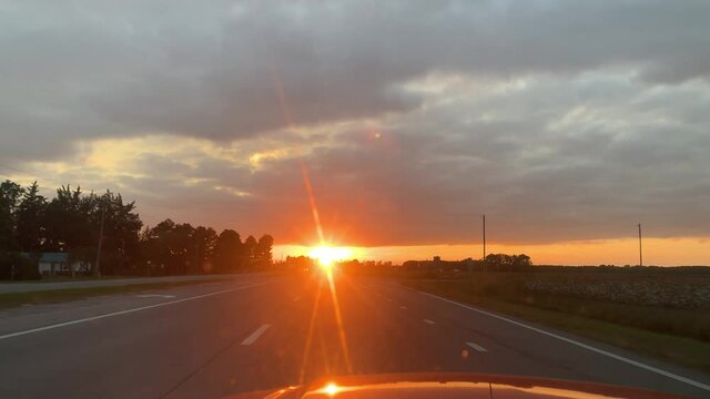 sunset on busy highway in rural area