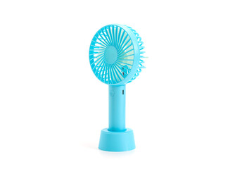 blue mini electric portable fan isolated on a white background.
