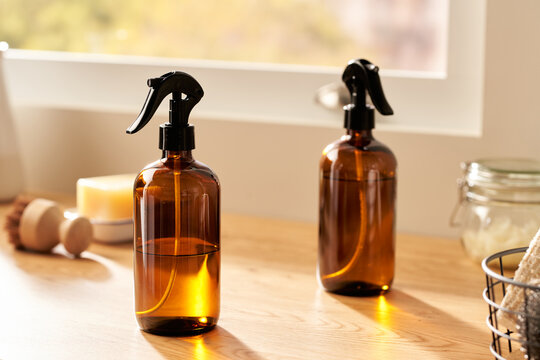 Natural cleaners in bottles in kitchen