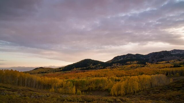 Sunset timelapse over Aspen Tree forest in Utah from Bonanza Flats looking over Wasatch Mountain State Park.