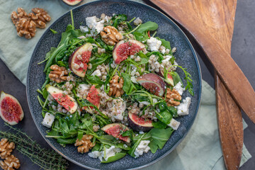healthy barley salad with fresh figs, feta cheese and walnuts