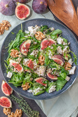 healthy barley salad with fresh figs, feta cheese and walnuts
