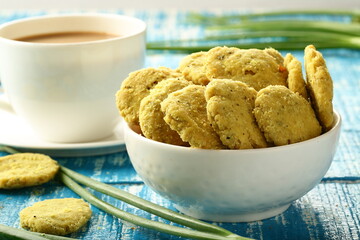 Delicious homemade Indian savory snack food- mathri served with Milk tea.