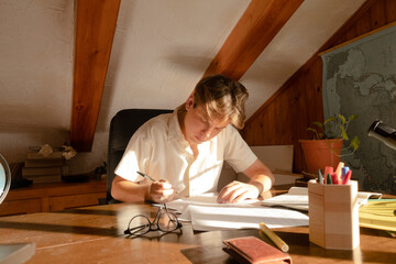 Pensive student sitting writting