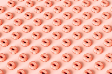 A lot of identical pink donuts
