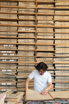 Person Reading Publication In Archive