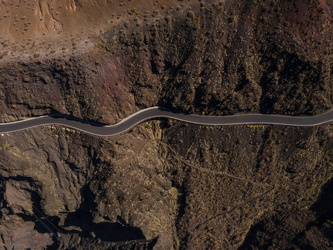 Curvy road on rocky slope