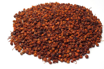 white background dry dried mountain ash berry tea Herbal tea. Close up. High resolution