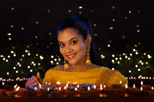 Portrait of a beautiful girl posing in front of camera on Diwali