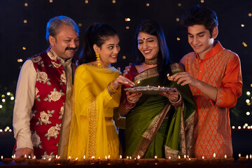 Portrait of a Indian family celebrating Diwali together