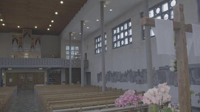 Easter decorated cross in empty Bruder Klaus church in Gundelfingen, Germany