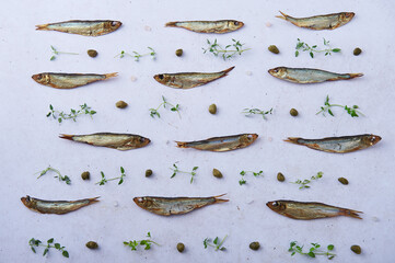 Smoked european sprats over white background