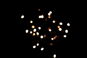 Golden bokeh lights on dark background