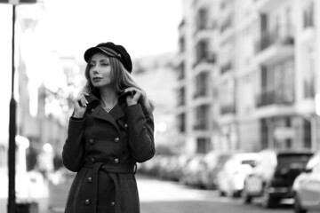 Black and white portrait of a woman in the street