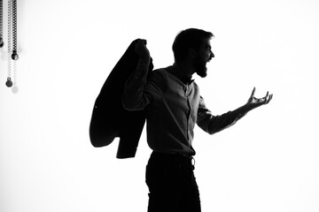 The man in a suit Secret agent with a gun in the hands of a crime posing studio