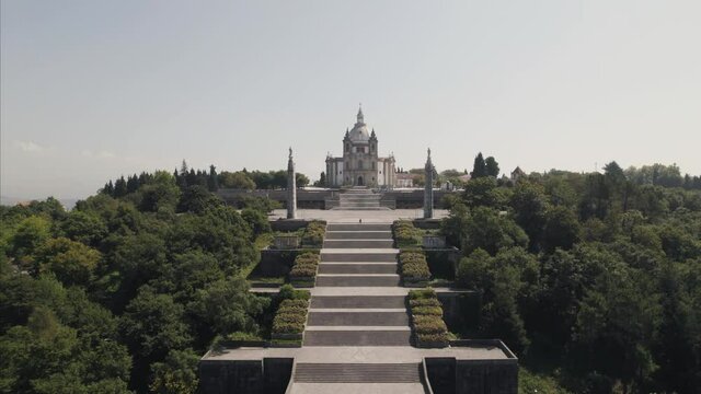 Cinematic pull out shot away from Sameiro Sanctuary complex and stairway in Braga Portugal.