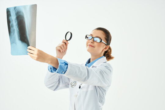 doctor in white coat with x-ray health care isolated background