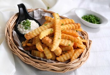 Homemade baked potato fries with sour cream and rosemary 