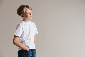 Portrait of a casual preteen boy in t-shirt standing