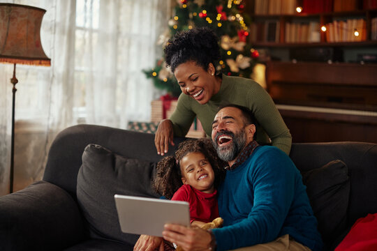 Family celebrating Christmas time via technology