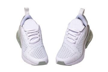 White sneaker isolated. Close-up of a pair white elegant stylish female leather high-heeled sport shoes isolated on a white background. Womens shoe fashion. Modern design footwear for workout. Macro.
