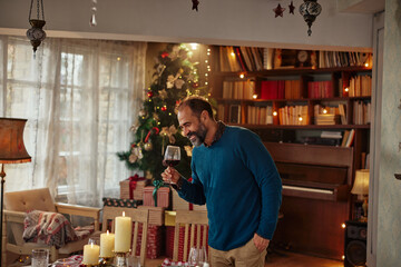 Man decorating table for Christmas dinner