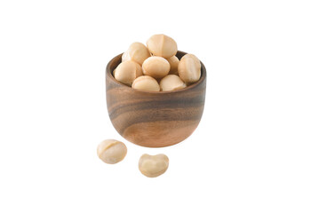 Macadamia nuts in wooden bowl on white background