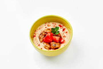 Hummus with chicken. A dish of crushed chickpeas for delivery, or online store. Isolated on a white background.