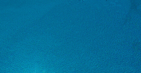 Beautiful outdoor swimming pool in hotel resort - Holiday Vacation concept for background.