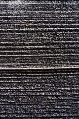 Texture of frozen plowed field from above, drone photography