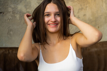 Close-up portrait of a beautiful young caucasian woman with natural brown hair.