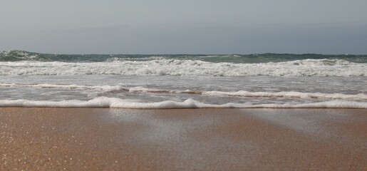 close - up soft and foamy wave of the sea