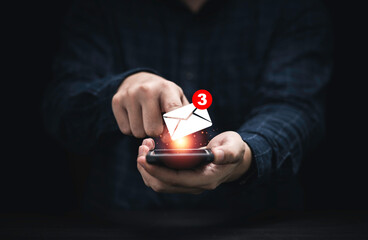 Businessman using smartphone with white newsletters and notification for business e-mail and...