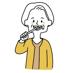 歯磨きしている高齢女性