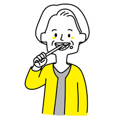 歯磨きしている高齢女性