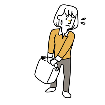 重いタンクを運んでいる女性