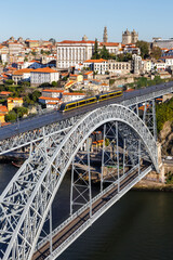 Porto Portugal with bridge Ponte Dom Luis I Douro river with tram town travel portrait format - obrazy, fototapety, plakaty